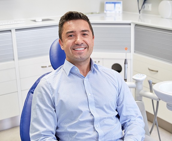 Smiling man in dental chair