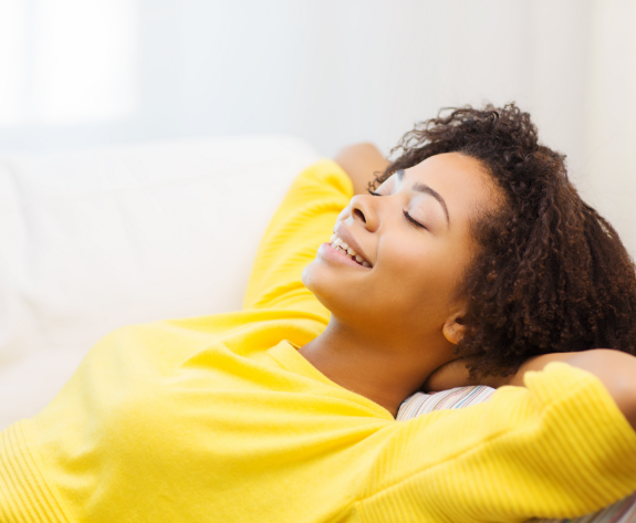 patient in yellow shirt smiling