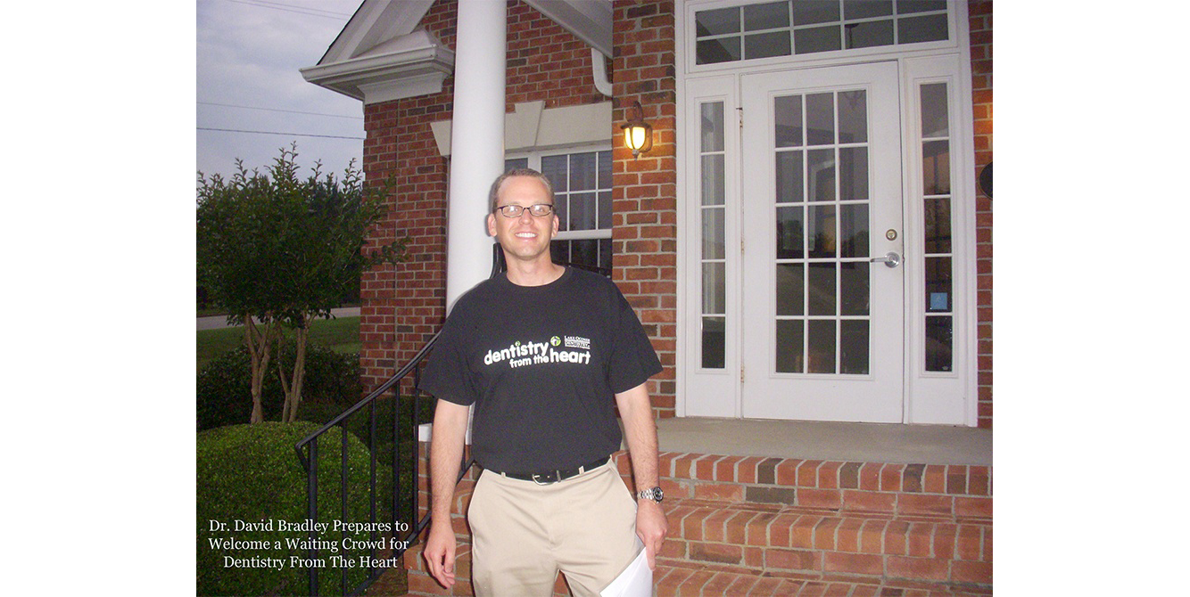 Dentist in front of dental office building