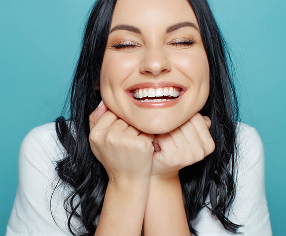 Woman showing off smile after teeth whitening