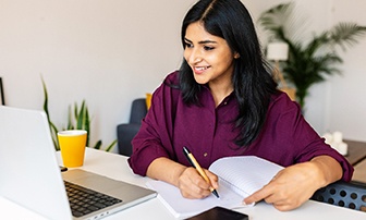 Smiling woman working at home