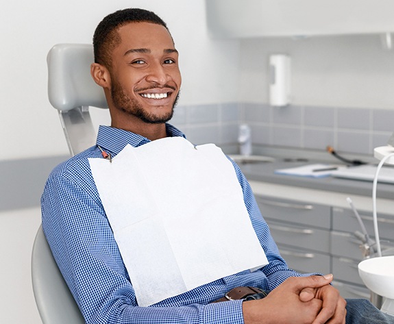 Man smiling after tooth extraction