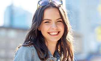 Young woman smiling after wisdom tooth extraction