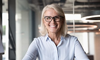 Woman with dental implants in Greensboro