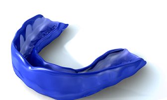 Close up of blue mouthguard with white background
