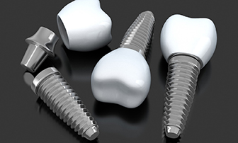 three dental implants lying on a flat surface 