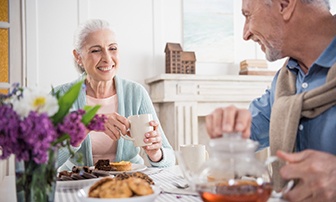 couple enjoying a meal together at their kitchen table