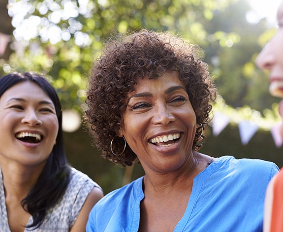 group of women laughing together outside