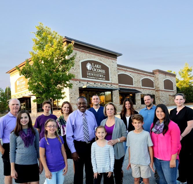 Preventive dentistry patients in front of Greensboro Georgia dental office building