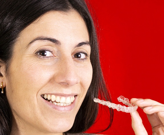 Woman with CompleClear in Greensboro on red background