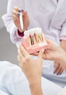 patient smiling in dental mirror