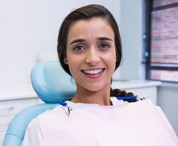 Woman in dental chair smiling