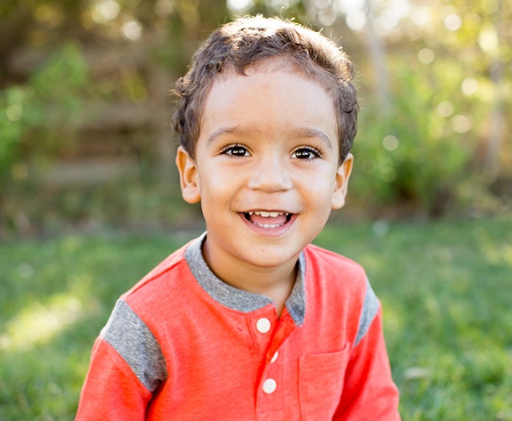 Young child with healthy smile after children's dentistry visit