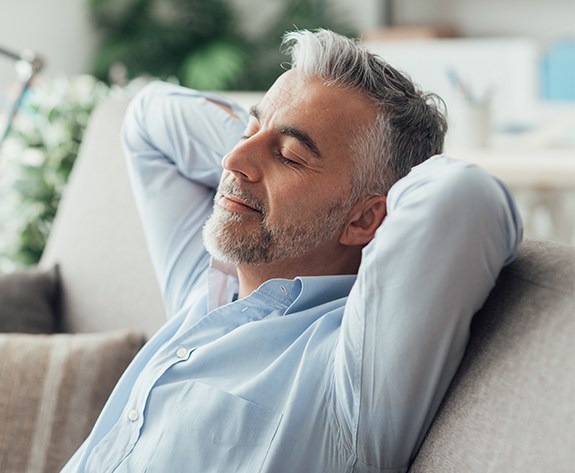 Man relaxing after sedation dentistry visit