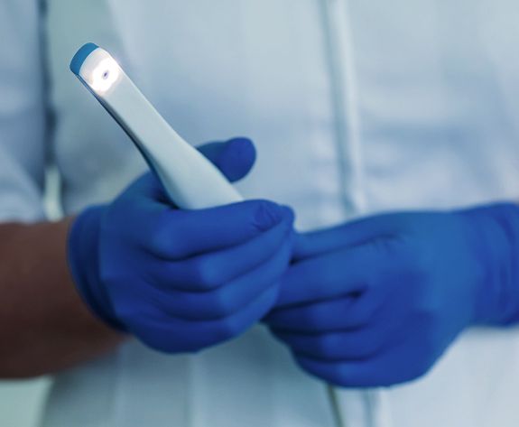 Dentist holding an intraoral camera