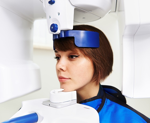 Woman receiving C T cone beam x-ray scans