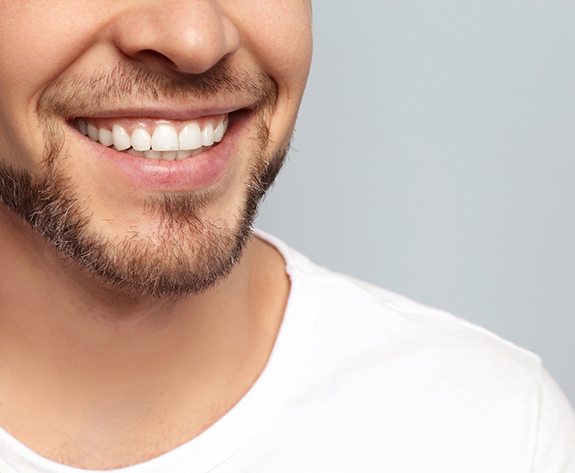 closeup on a man’s smile after getting veneers in Lake Oconee