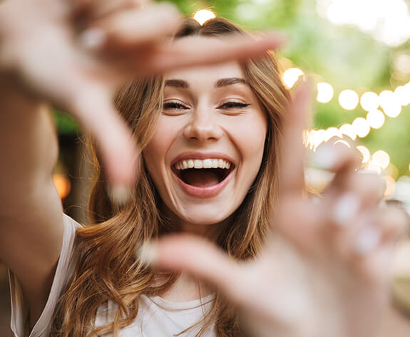 Woman showing off smile after teeth whitening