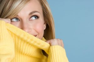 woman hiding smile embarassed