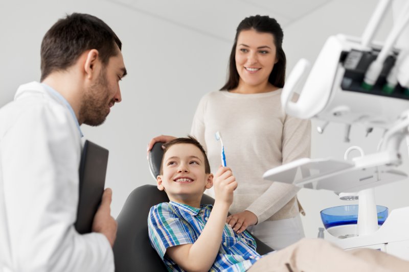 parent and child visiting a family dentist in Greensboro
